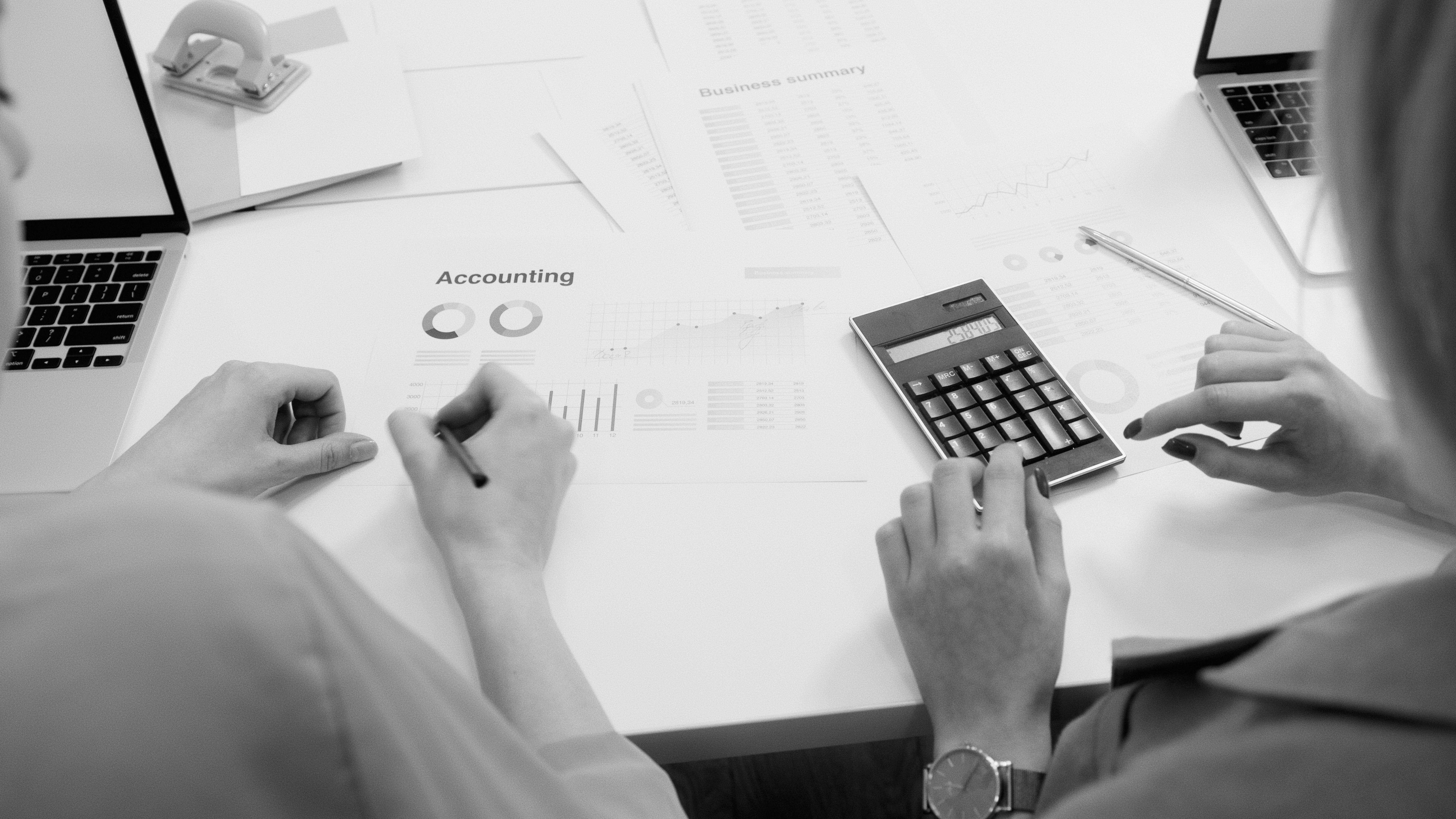 Business owner reviewing accounting and cash flow figures